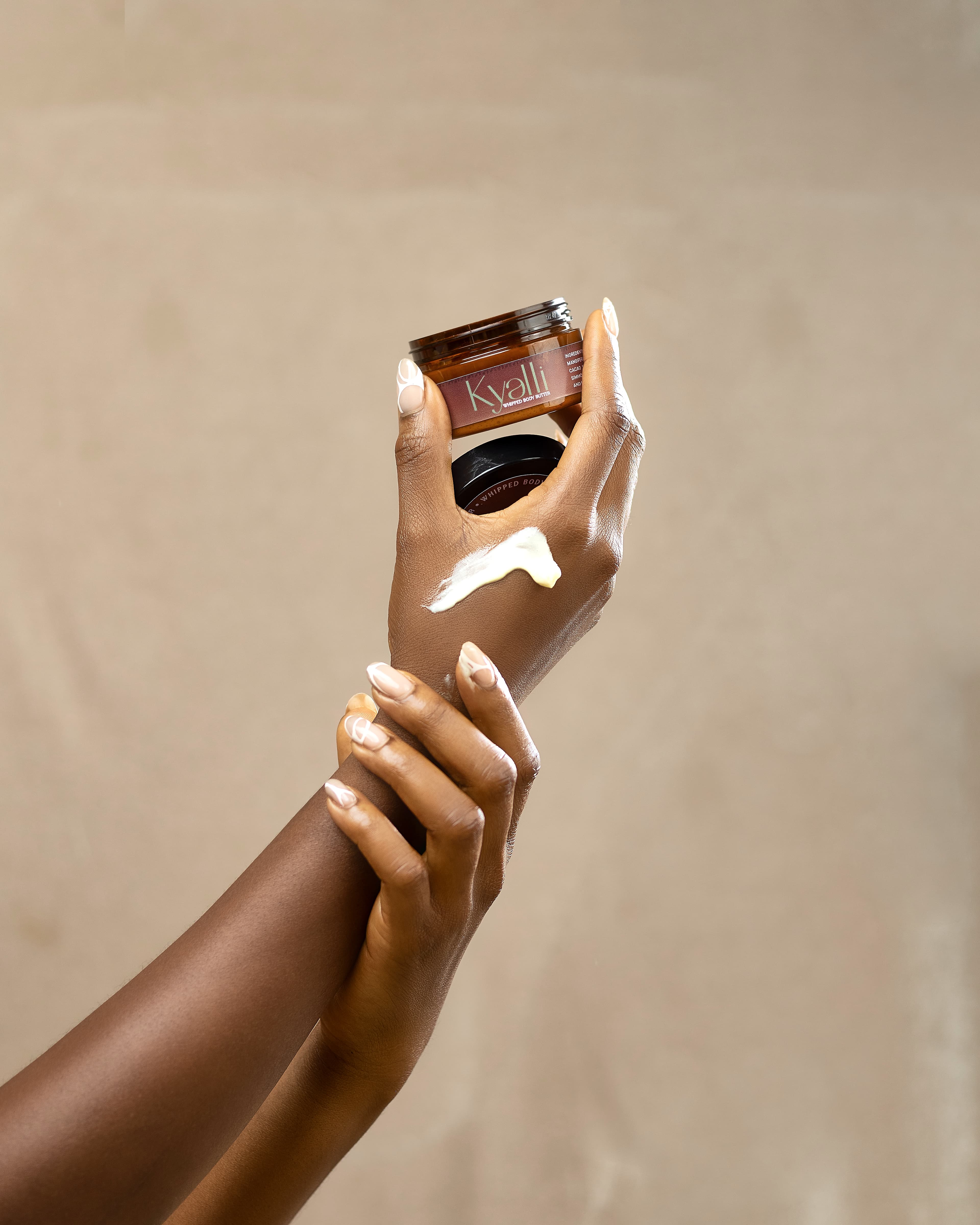 Whipped body butter melting into skin